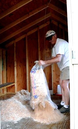 Putting Bedding in the Coop