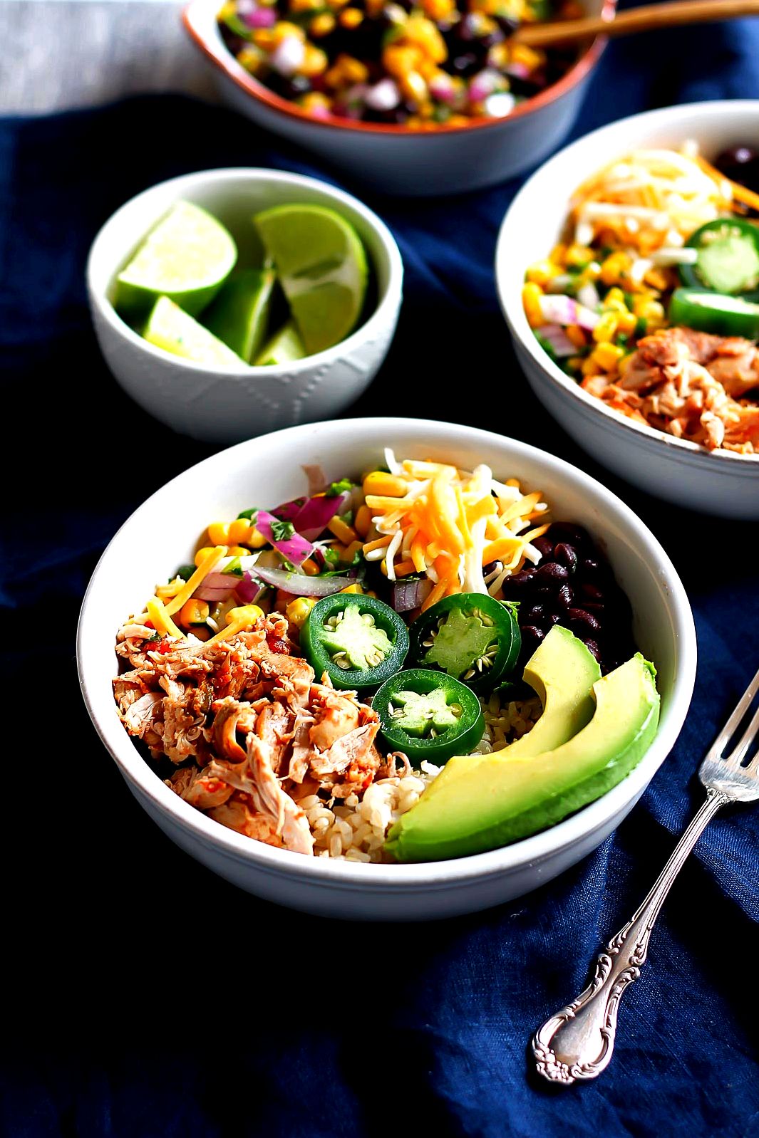 Better than Chipotle DIY Chicken Burrito Bowls that are awesome for clean eating and healthy meal prep. Cheap & easy to make. Chicken can be made in the slow cooker too!